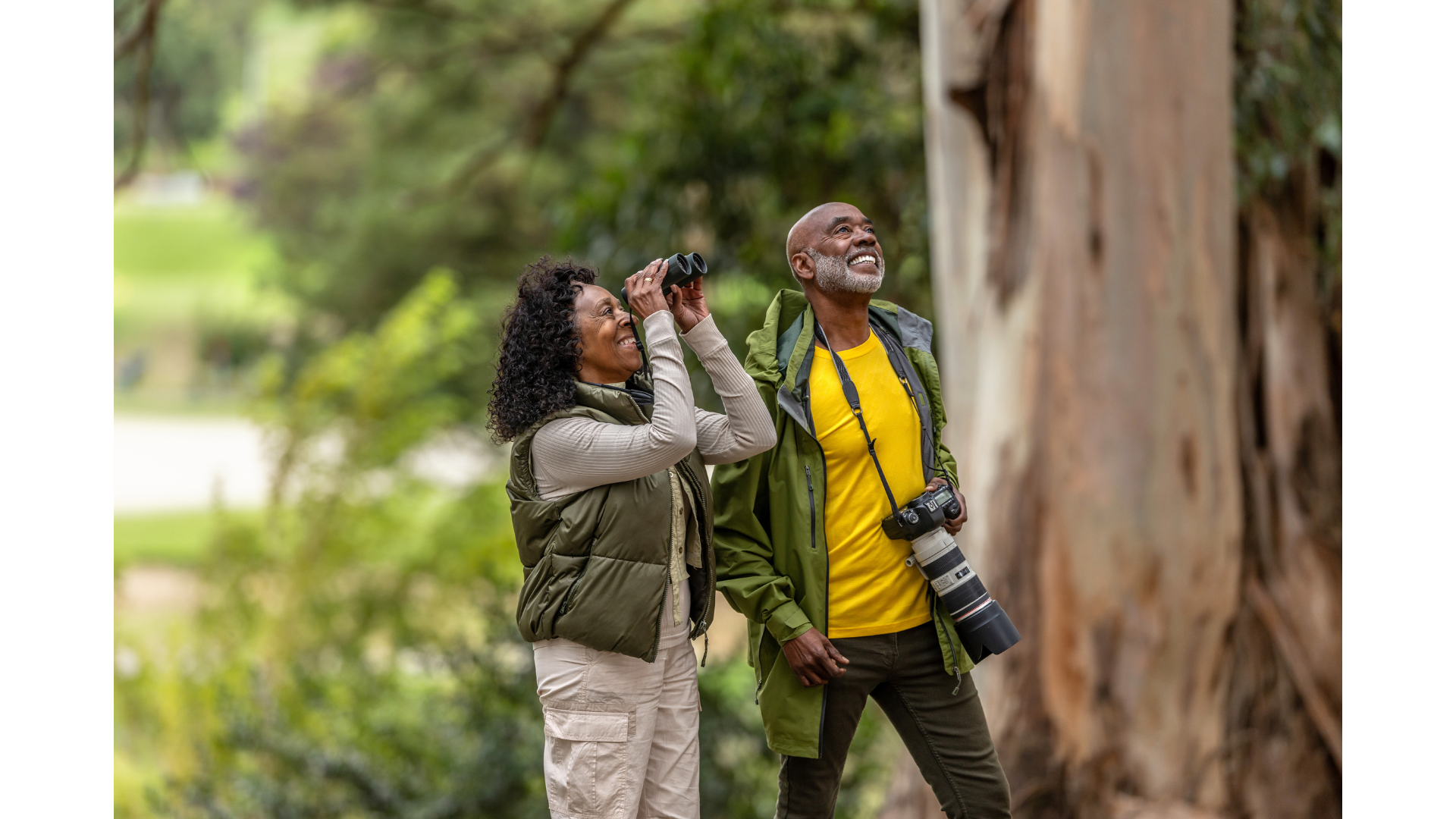 A group of backpackers hiking near a stream
